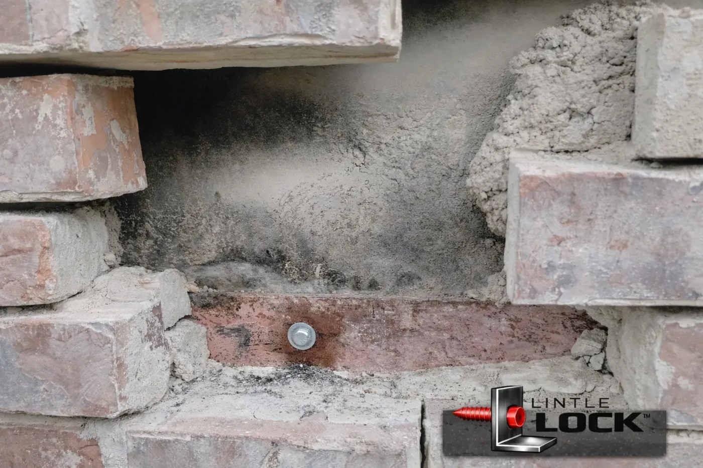 Exposed brick wall above garage door with LintelLOCK™ system (LintelLOCK™ logo watermark)